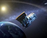 This artist's concept shows the Wide-field Infrared Survey Explorer, or WISE spacecraft, in its orbit around Earth.
Image: NASA.